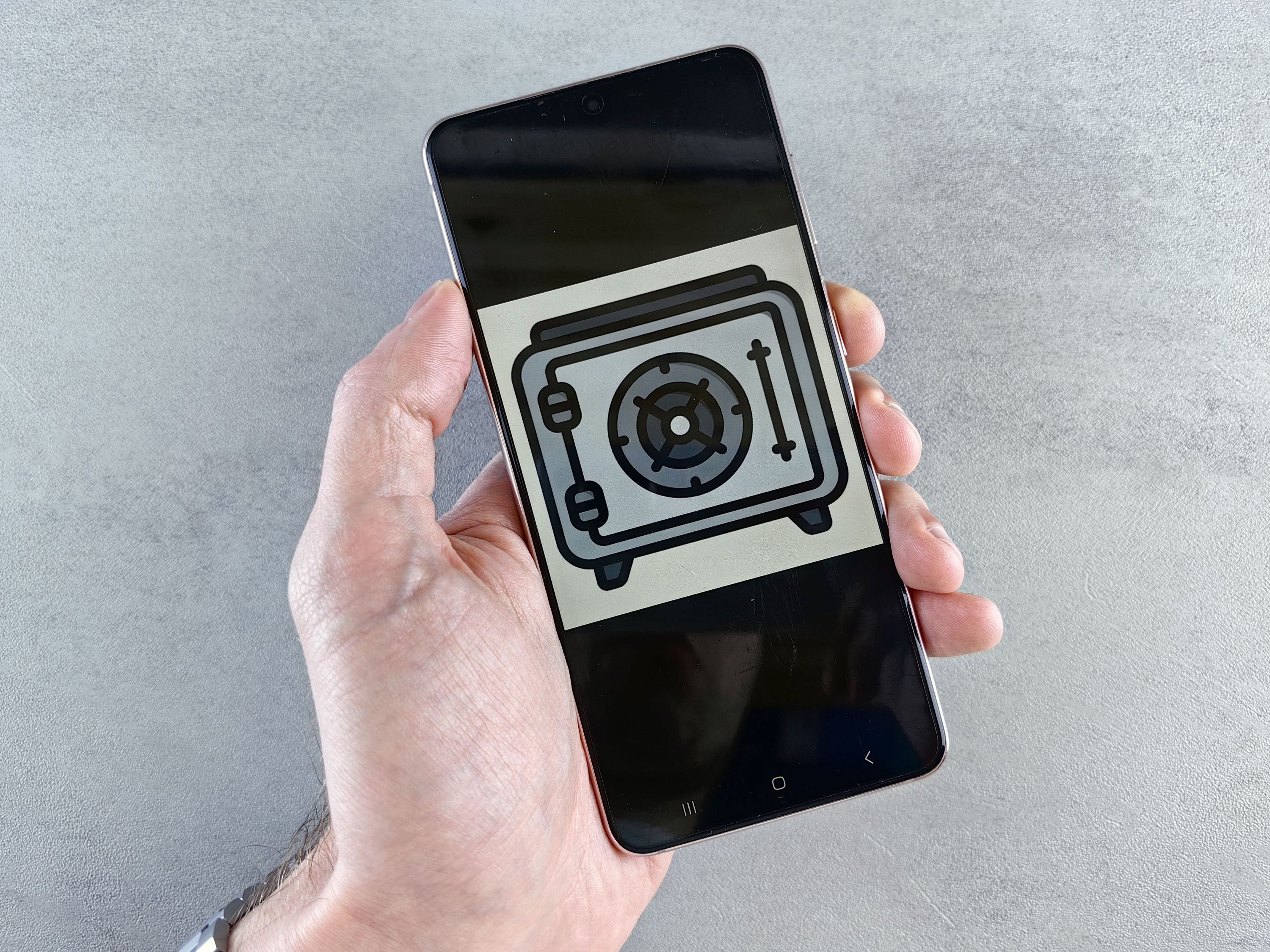 a phone holding a small vault icon